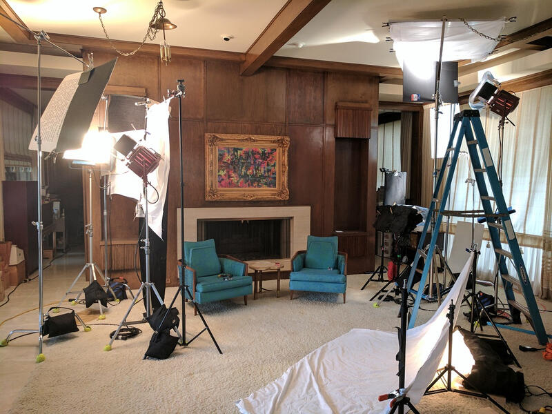 Lit living room showcasing various lighting strategies. "The Painting," Kaitlyn Shelby, 2018.